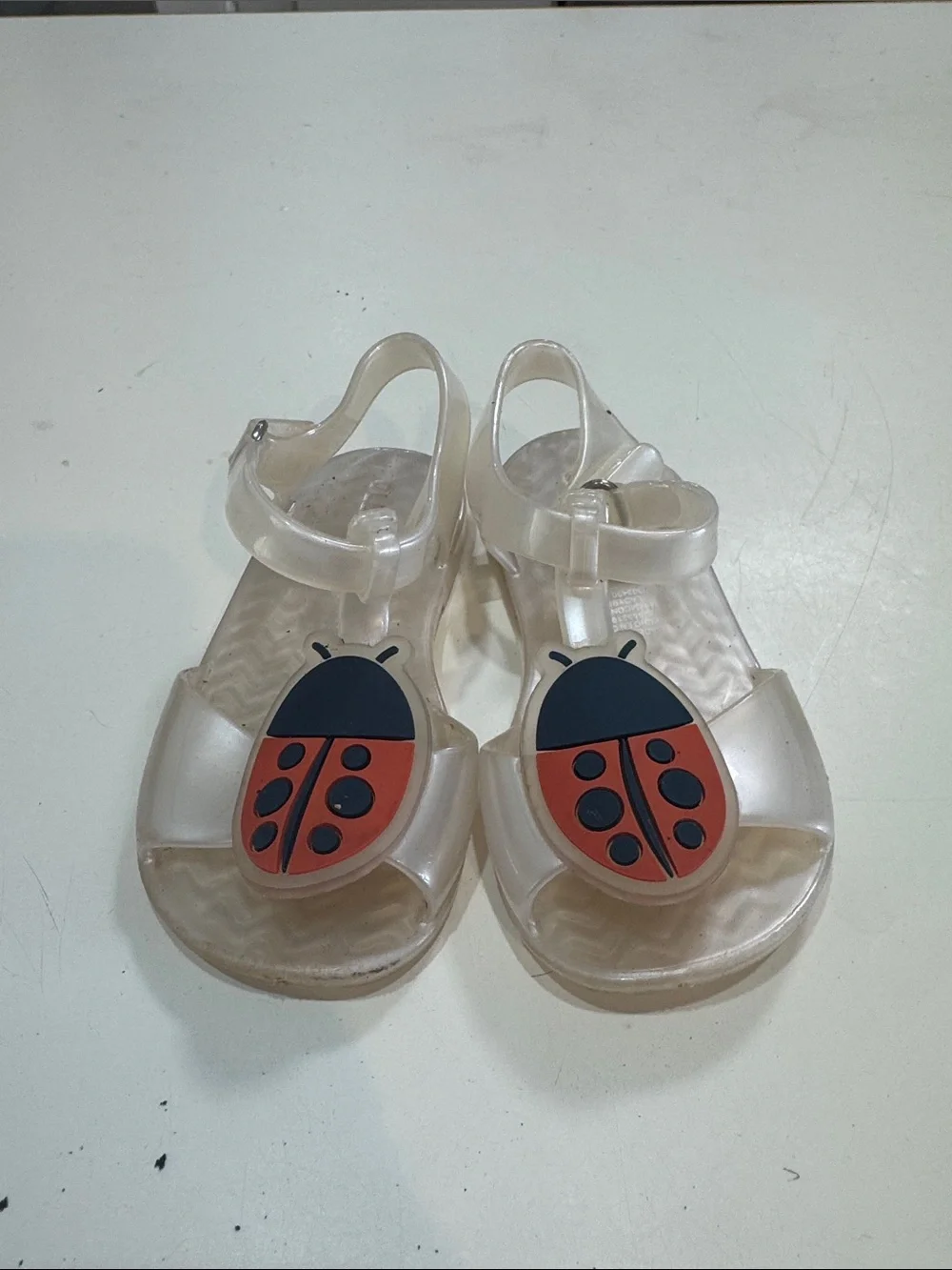 Clear Kids Jelly Sandals with Red Ladybug Accent